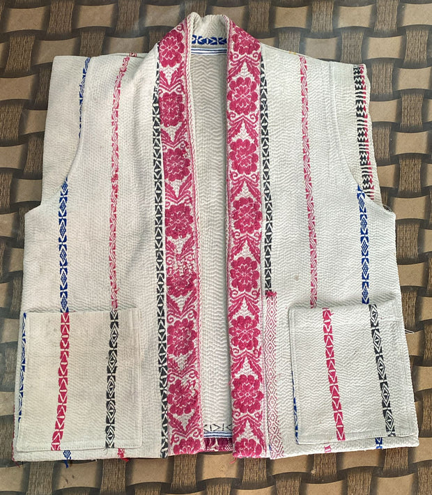 Handcrafted kantha quilt showcasing vibrant patterns as a perfect addition to sustainable fashion home décor.