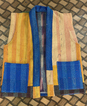 Handcrafted kantha quilt showcasing vibrant patterns as a perfect addition to sustainable fashion home décor.