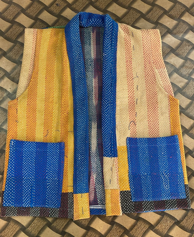Handcrafted kantha quilt showcasing vibrant patterns as a perfect addition to sustainable fashion home décor.