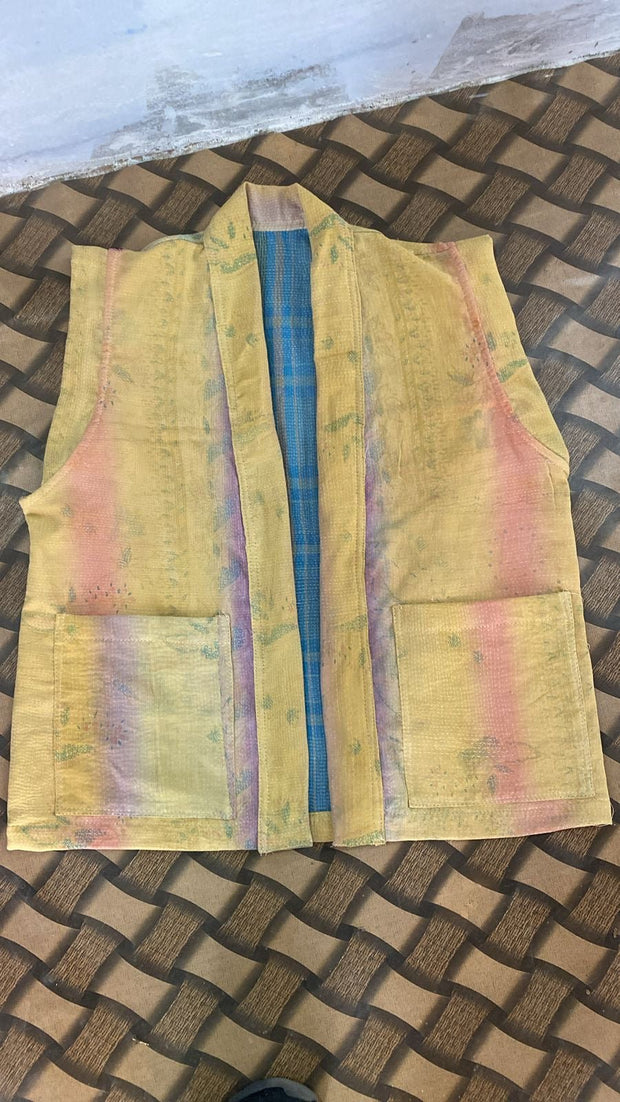 Handcrafted kantha quilt showcasing vibrant patterns as a perfect addition to sustainable fashion home décor.