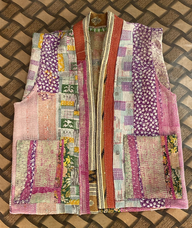 Handcrafted kantha quilt showcasing vibrant patterns as a perfect addition to sustainable fashion home décor.