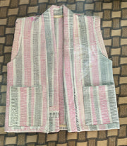 Handcrafted kantha quilt showcasing vibrant patterns as a perfect addition to sustainable fashion home décor.